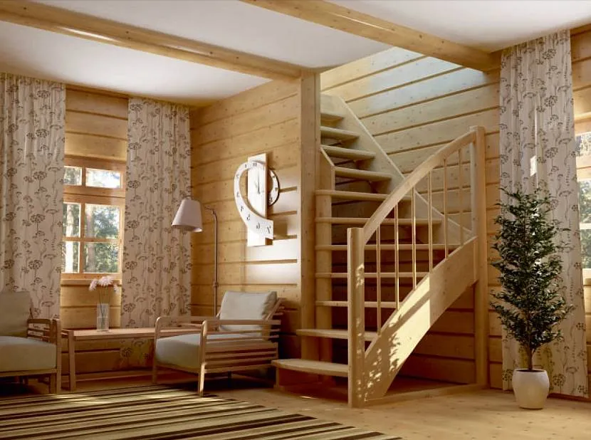 Класичні сходи між поверхами в інтер'єрі дерев'яного будинку