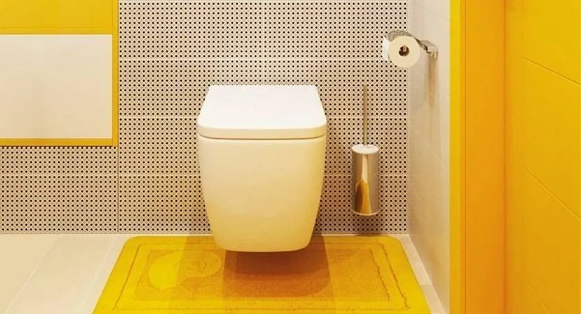 Яскраві помаранчеві елементи у дизайні туалету